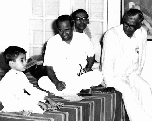 Vijay Siva, the child prodigy, identifies ragas as a three year old at the Music College in Chennai, watched by T.M.Thyagarajan and Prof. Balakrishnan